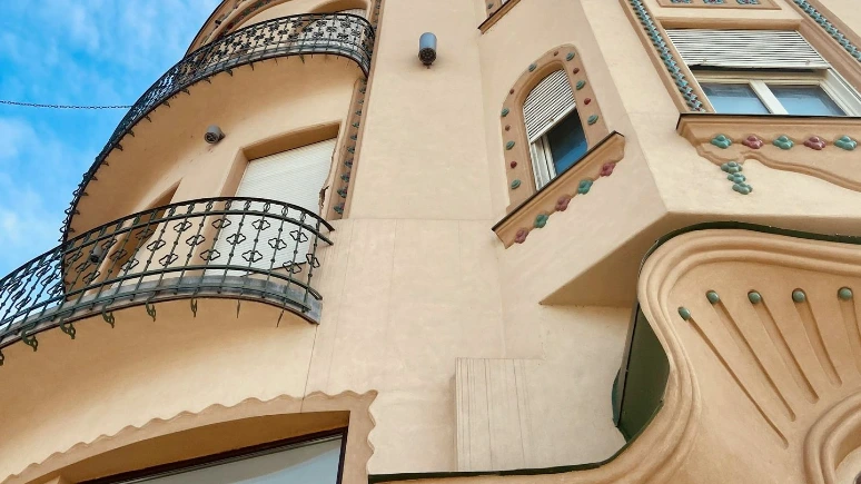a tall building with a balcony and balconies